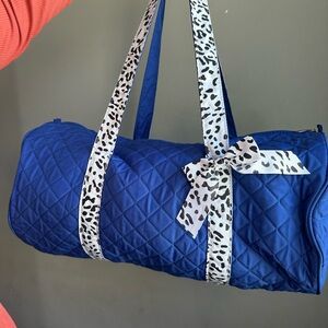 Elegant Blue Quilted Shoulder Bag with Animal Print Bow